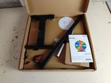 a box that has a pen, scissors, and other items in it