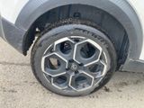 a tire that has been left on the side of a car