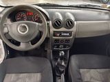 a dashboard of a small car with a steering wheel