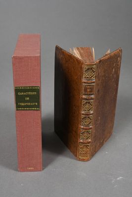two books sitting next to each other on a gray surface