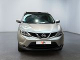 the front of a silver nissan qx - v parked in a showroom