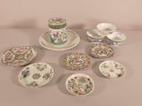 many different plates and bowls on the table