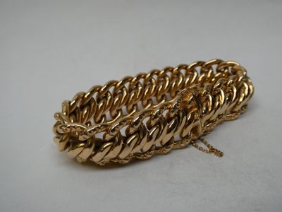 Large bracelet gourmette en or jaune 18K, fermoir à chaînett…