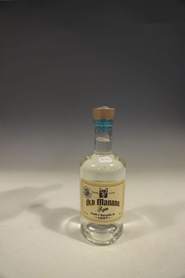 a small bottle of alcohol sitting on a table