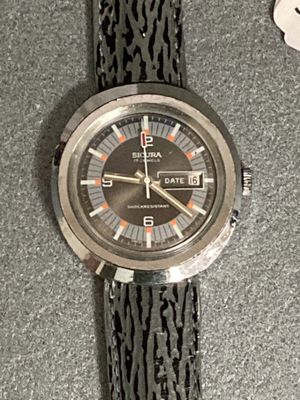 a close up of a wrist watch on a table