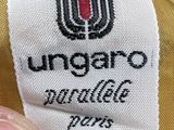 someone is holding a ungaro bag with a label on it