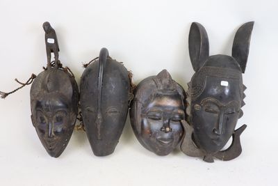Lot de quatre masques dont Gouro, Afrique XXeme siècle.