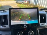 a picture of a car dashboard with a monitor on it