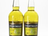 two bottles of chartreuse and a bottle of lemon