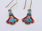 a pair of earrings with red and blue flowers on them