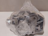 a plastic bag filled with assorted items sitting on a table
