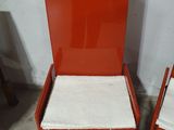 two chairs that are sitting next to each other in a room