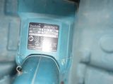 a close up of a blue machine with a label on it