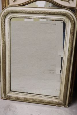 a mirror that is sitting on the floor next to another mirror