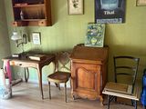 an image of a living room with green walls and wood floors