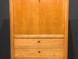 an image of a wooden cabinet with a marble top