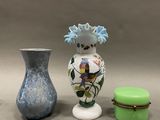 three vases sitting next to each other on a table