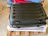 a stack of luggage sitting on top of a pallet