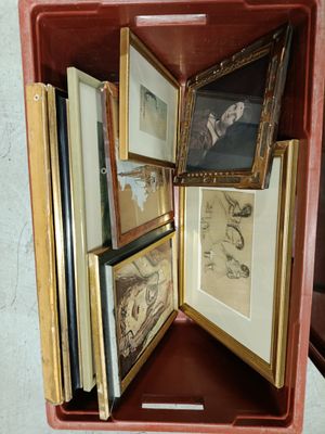 a red case with pictures inside of it on a table