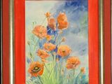 framed watercolor painting of orange poppies against a blue sky