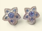 pair of blue and white crystal earrings on a white surface