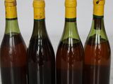 three bottles of wine are lined up on a table