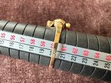 a ruler that is on top of a brown blanket