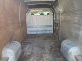 the back end of a van with the door open showing the inside of it