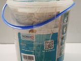 a plastic bucket with a blue handle sitting on a table