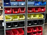 many bins of different colors and sizes on the shelves