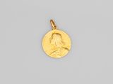 une pièce d'or portant le portrait d'un homme