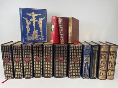 several old books are stacked on top of each other on a table