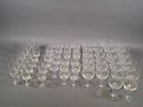 a lot of empty wine glasses sitting on a table