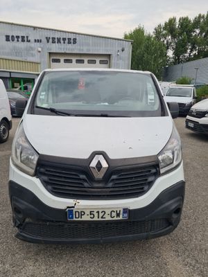 the front view of a white van parked in a parking lot