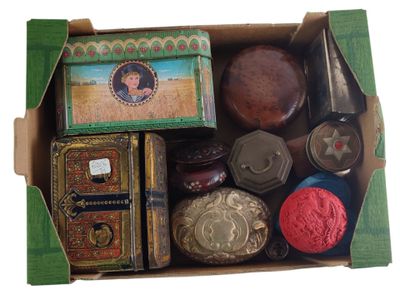 a box of assorted items in it on a white surface