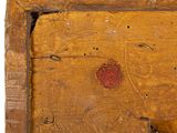 a close up of a piece of wood with a red heart on it