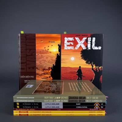 three books stacked on top of each other on a table
