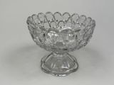 a glass bowl that is sitting on a table