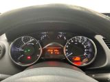 a close up of a car dashboard with various gauges