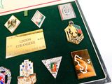 a display case with a lot of badges on it