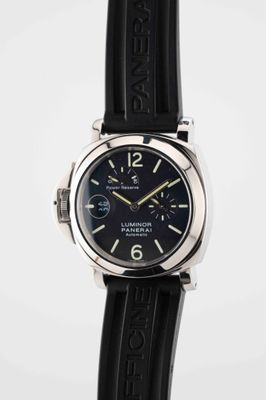the watch is black with a black dial and black rubber strap