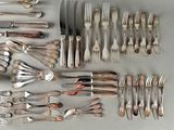 many different types of silverware on the table