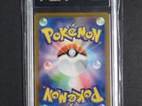 a close up of a pokemon card on a black surface