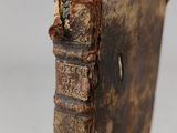 an old book sitting on top of a wooden table
