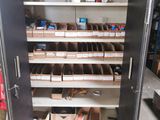 a metal cabinet that has many shelves in it