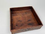 an image of a wooden tray with a handle on a white surface