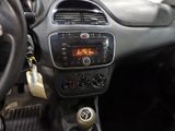 the dashboard of a car with a digital clock on the dash
