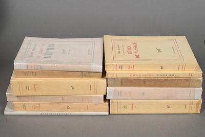 several books stacked on top of each other on a table