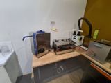 a picture of a kitchen with a sink, microwave and toaster