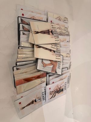 a lot of books that are stacked up on a wall